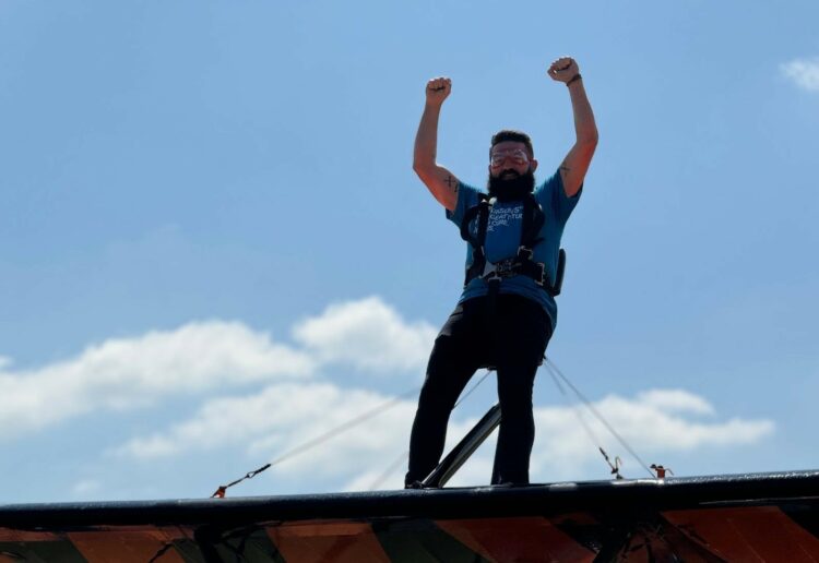 Ben Gee from Hat & Home is strapped in for a fundraising wing walk