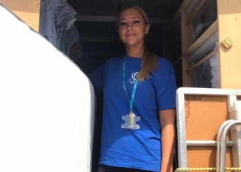 A First Days Children's Charity family support worker making a delivery of a bed to a family. Picture: First Days