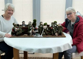Anne Constable (left) and Judith Matthews helped to create one of the 80 crocheted panels for an 80 metre long artwork, currently on view in Normandy, but destined to tour internationally thereafter. Picture: Neil Constable