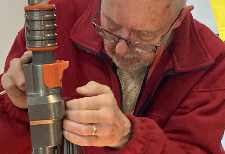 The team of fixers at Wokingham Repair Cafe have reached the UK's top 10, repairing 108 items in just two sessions. One of the team is here hard at work. Picture: Emma Merchant