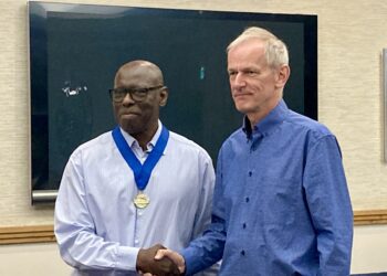 Outgoing Wokingham Toastmaster chair Graeme Hobbs, right, congratulates Garfield Reece who takes on the role at the group's annual gathering, held at Bearwood Lakes Golf Club. Picture: Emma Merchant