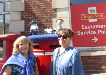 Alison Sanders, Chair of The Arts Society Wokingham, left, and Gaynor White from the Barkham Hookers unveiled a new crocheted post box topper to celebrate 10 years of arts lectures in the borough. Picture: The Arts Society Wokingham