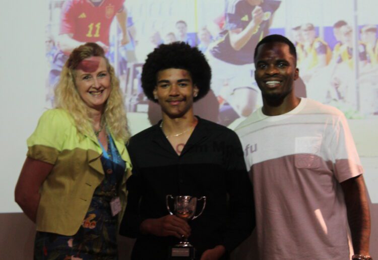 Cam (centre) has signed for Machester United.