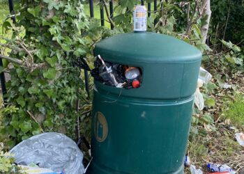 A bottle of urine has been left next to this bin Picture: Phil Creighton