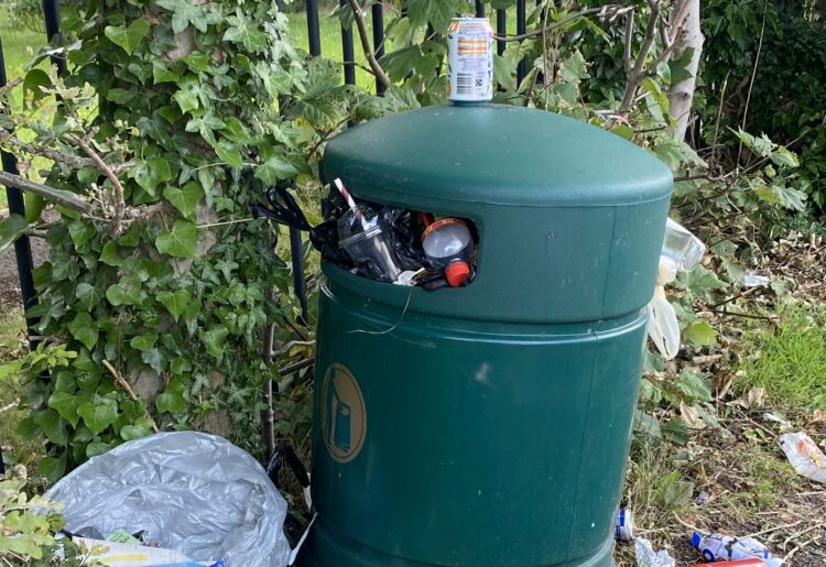 A bottle of urine has been left next to this bin Picture: Phil Creighton