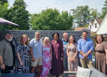 Janet Daby, the new minister for children and families, with foster carers and staff.