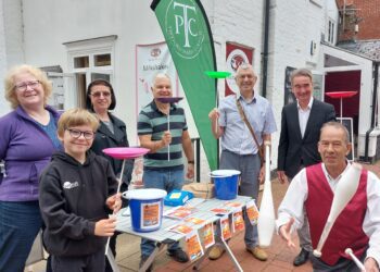 Twyford Parish councillors Sue Wisdom, Liz Ashley and Charles Wickenden, Twyford Parish Council chairman and borough councillor Martin Alder and Wokingham Borough Council leader Stephen Conway  with young plate spinner Jacob and Mark the juggler are pictured outside Waitrose Twyford. Pints of concrete for the new skatepark were on sale. Visiting circus skills expert Charles was teaching plate spinning.