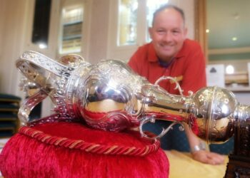 Mayor's attendant David Dunham with the mace that dates back to 1758.