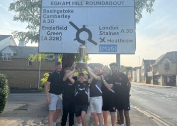 Wokingham Town players with the trophy in Egham