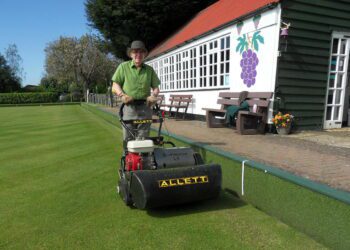 David Ashley in action with the lawn mower at Hurst Bowling Club.
