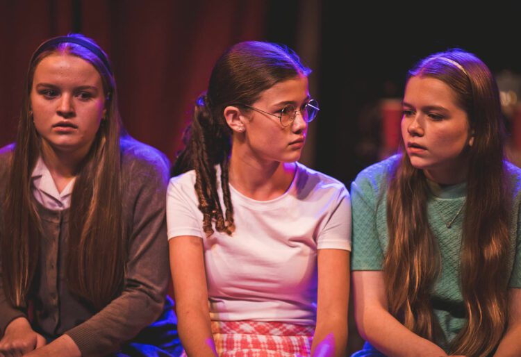 Young Kath (Isobel Henry), Young Penny (Gabriella Palmaeri), and Young Ruby (Piper Charman) in The Sounds By The Sea at South Hill Park this week. Picture: Asun Olivan