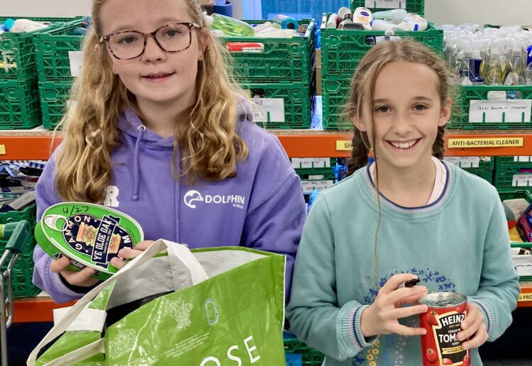 Pupils from Dolphin School, Hurst rolled up their sleeves to help at Wokingham Foodbank. Picture: Emma Merchant