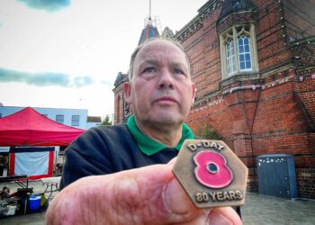 David Dunham, poppy appeal coordinator for Wokingham, holds an 80th anniversary commemorative badge. Events around the borough will remember the sacrifices made. Picture:Andrew Batt