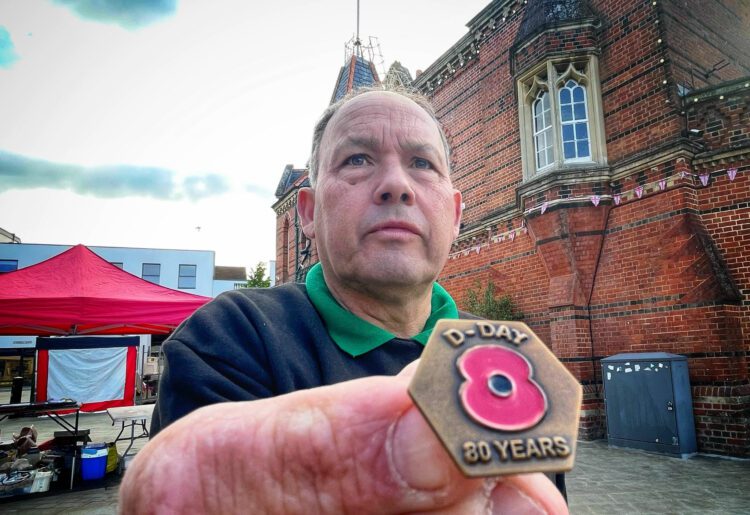 David Dunham, poppy appeal coordinator for Wokingham, holds an 80th anniversary commemorative badge. Events around the borough will remember the sacrifices made. Picture:Andrew Batt
