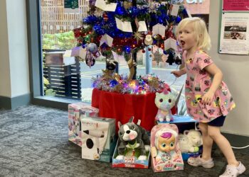 Paige took this year's first gift tag from the first GIving Tree 2024. Picture: Emma Merchant