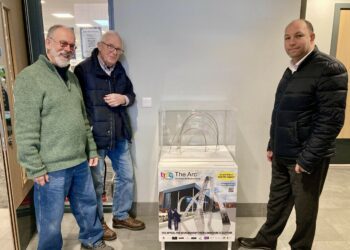 A model of The Arc, a steel sculpture planned for the entrance to The Hub, was installed at the entrance to the library by Tim Lloyd and Robin Cops from Arts4Wokingham, and Tony Penge general manager of Places Leisure Wokingham. Picture: Emma Merchant