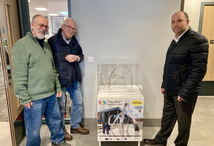 A model of The Arc, a steel sculpture planned for the entrance to The Hub, was installed at the entrance to the library by Tim Lloyd and Robin Cops from Arts4Wokingham, and Tony Penge general manager of Places Leisure Wokingham. Picture: Emma Merchant