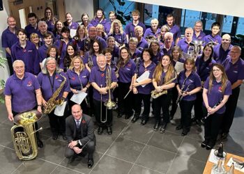 Trinity Concert Band celebrates platinum success. Concert manager and E flat clarinettist stuart Freebody proudly holds the award. Picture courtesy of Trinity Concert Band
