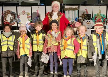 Children from borough schools delivered their Christmas decorations to Wokingham Town Mayor Cllr Rob Comber. Pic: Emma Merchant