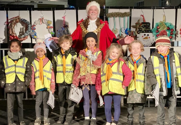 Children from borough schools delivered their Christmas decorations to Wokingham Town Mayor Cllr Rob Comber. Pic: Emma Merchant