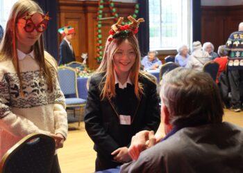 Year 8 students from Leighton Park welcomed guests from Age UK Reading to their Christmas Extravaganza. Picture: Leighton Park School