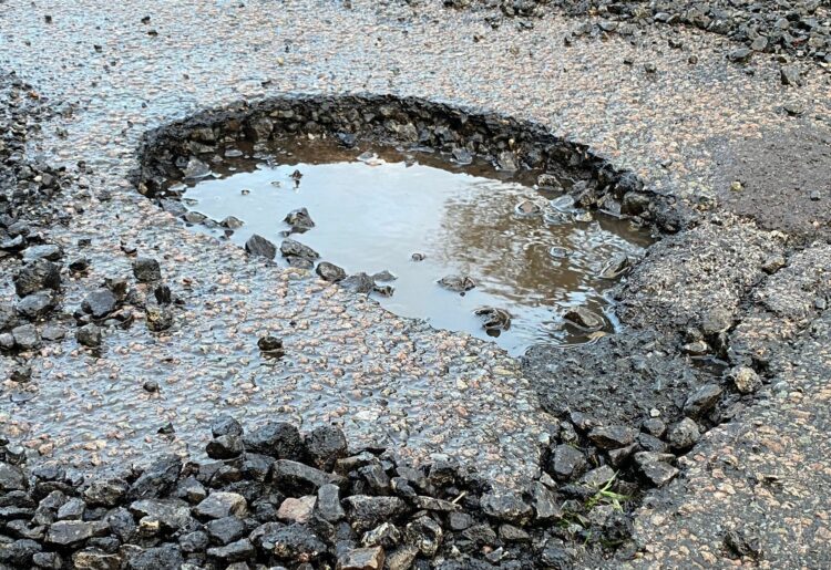 A pothole that appeared in Colemansmoor Lane in Woodley overnight on Friday, January 5 Picture: Phil Creighton