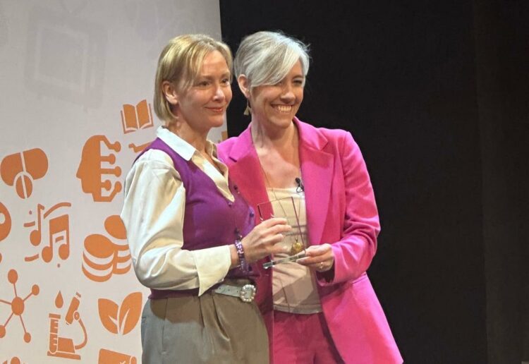 Louise Timlin (left) receiving an award.