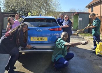Care staff at Austen House had fun carwashing for charity. Picture: Austen House