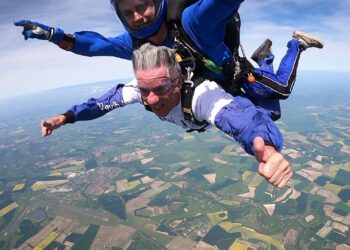 Swimmers and skydivers can help to raise funds for The Link at their next two events. Last year, Chair of the charity John Mallaghan took up the challenge. Picture: The Link Visiting Scheme