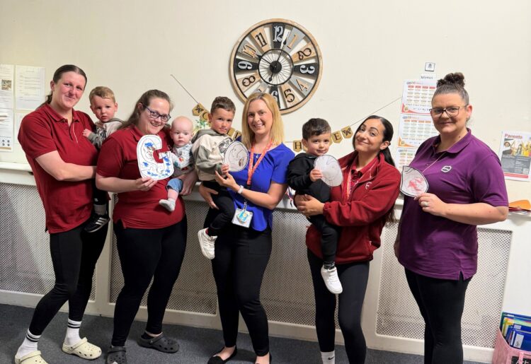 Team members and children at Partou Children?s House in Binfield celebrating their Ofsted report which rated the nursery ?Good? in all areas