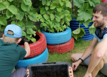 Beans get a compost treat at Gardening Club. Picture courtesy of CLASP Wokingham