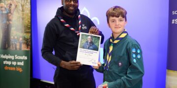 Harry Peksa from Wokingham received an award for outstanding community achievement, from Chief Scout Dwayne Fields. Picture: The Scouting Organisation