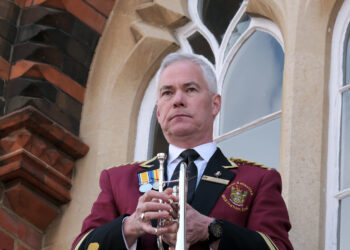 Damon Emes performed the Last Post from the town hall balcony. Pic: Andrew Batt.