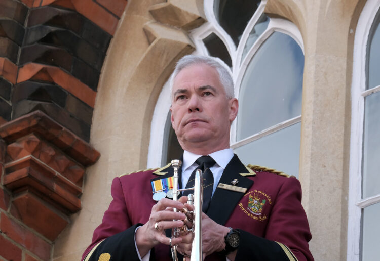 Damon Emes performed the Last Post from the town hall balcony. Pic: Andrew Batt.