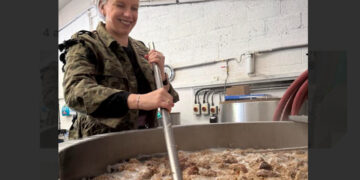 Claire Revie, founder of SHARE Wokingham, helps to create the new brew.