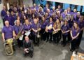 Trinity Concert Band celebrates platinum success. Concert manager and E flat clarinettist stuart Freebody proudly holds the award. Picture courtesy of Trinity Concert Band