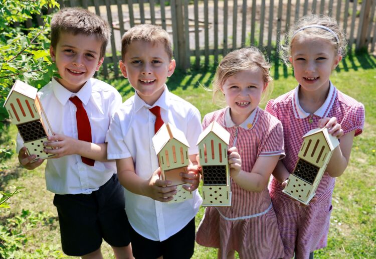 Pupils with the new bee hotels.