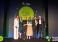The Newbury Building Society team receive an award from ceremony host, comedian Simon Evans..Credit: Smart Money People.