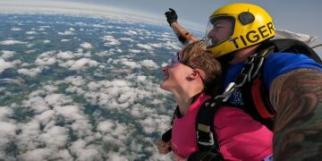 In memory of her brother, Ethan, Martha leapt from 15,000 feet over Old Sarum Airfield in Salisbury, along with dad Justin, 18-year-old brother Finlay and seven of Ethan?s friends. Picture: Brain Tumour Research