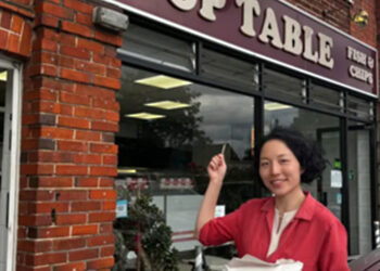 MP Yuam Yang outside the takeaway.