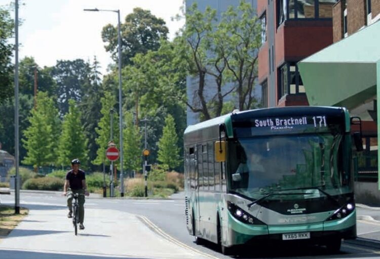 Cyclists and a bus stop in Bracknell. Credit: Bracknell Forest Council