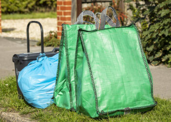 A food waste caddy, blue waste bag and green recycling bag from Wokingham Borough Council. Credit: Winnersh Parish Council/ Stewart Turkington.
