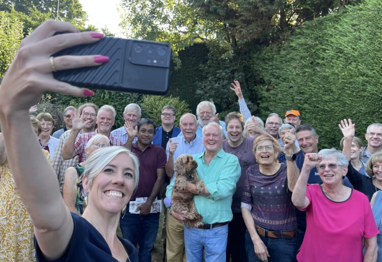 Daisy Cooper takes a selfie with Wokingham Liberal Democrat supporters, councillors and MP Clive Jones (centre, holding dog). Pic: Andrew Batt.