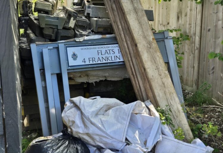 Road signs with the Wokingham Borough Council logo dumped behind Ashridge Farm in Bell Foundry Lane. Credit: Peter Humphreys