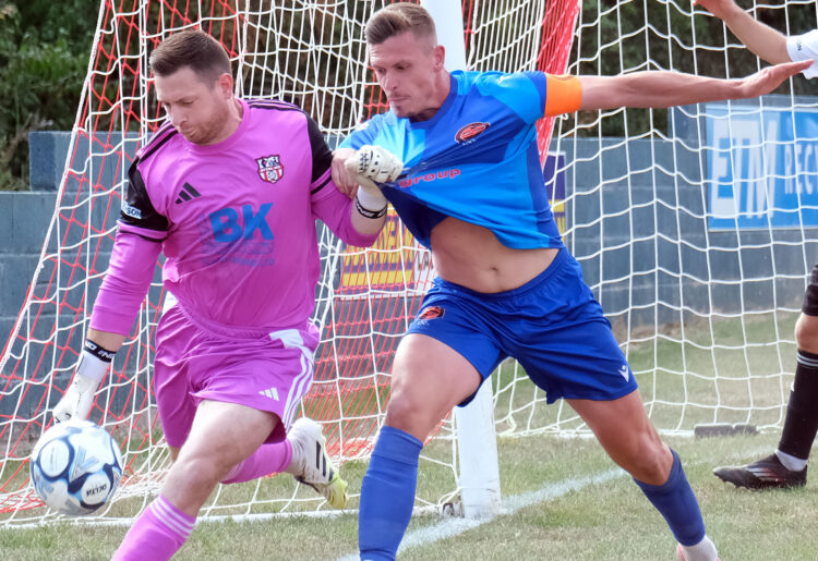 Captain Sean Moore (right) battles for the ball at Bitton. Pic: Andrew Batt.