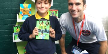Writer, speaker, and ex professional footballer Seth Burkett opened St Sebastian's CofE school library, to the excitement of pupils. Picture: St Sebastian CofE School