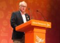 Clive Jones addressing the auditorium at Bournemouth International Centre. Pic: David Stone.
