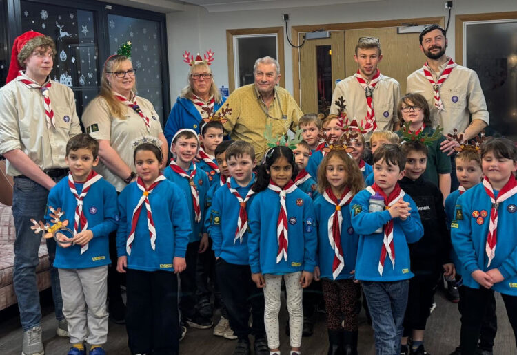 Mike Bowyers (centre), founder of 4th Wokingham Beavers was treated to a special concert performed by the pack. Picture: 4th Wokingham Beavers