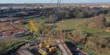 Each 125-tonne steel girder was installed using a, 500-tonne crane, helping to form part of what will be the new road. Pic: WBC.
