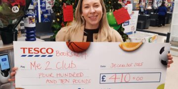Hannah Norris from Me2Club received a cheque from Tesco Wokingham's Community Bookshelf donations. Picture: Tesco Wokingham